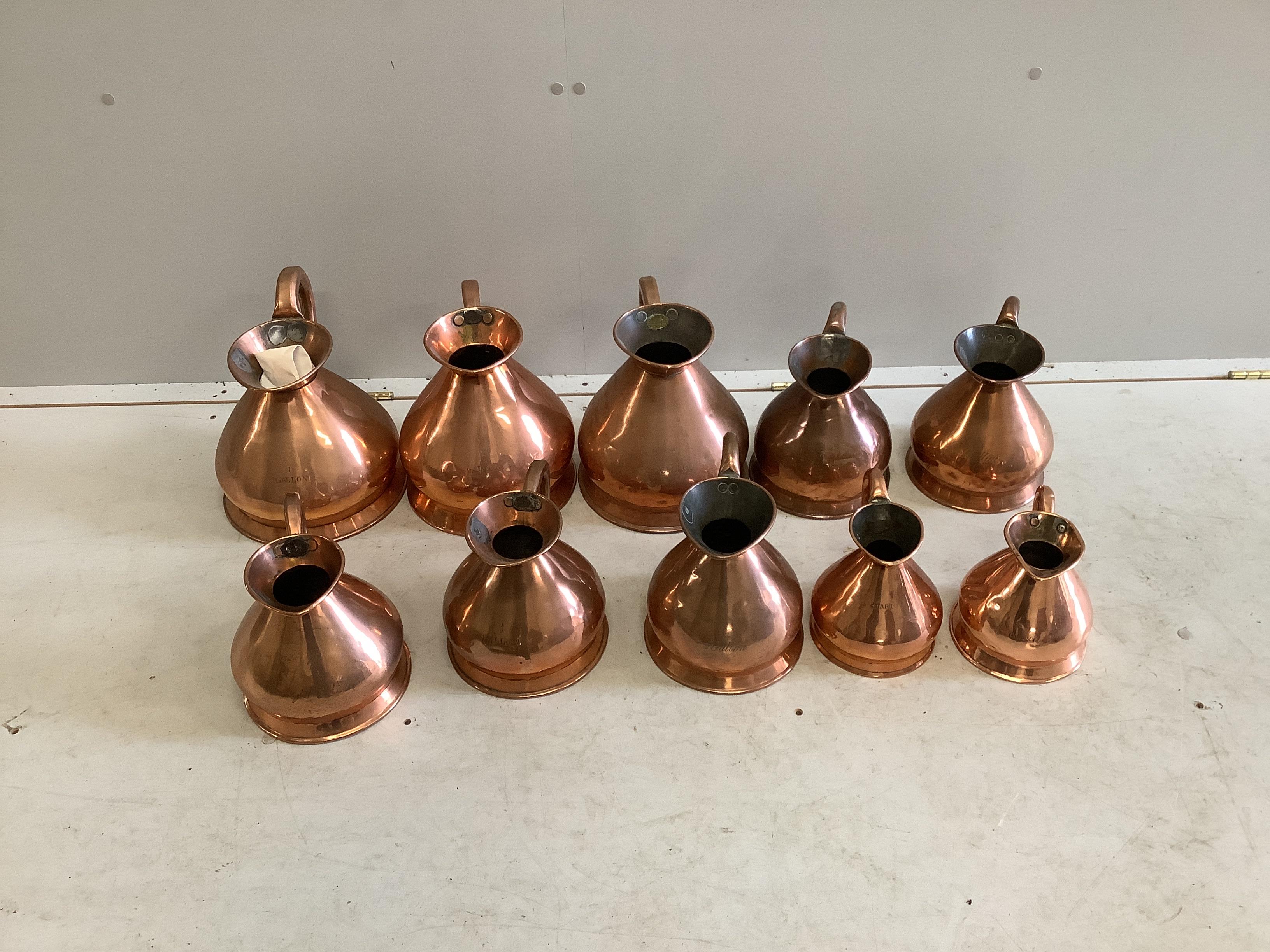 Ten 19th / early 20th century copper haystack measures, one gallon to a quart, largest height 27cm
